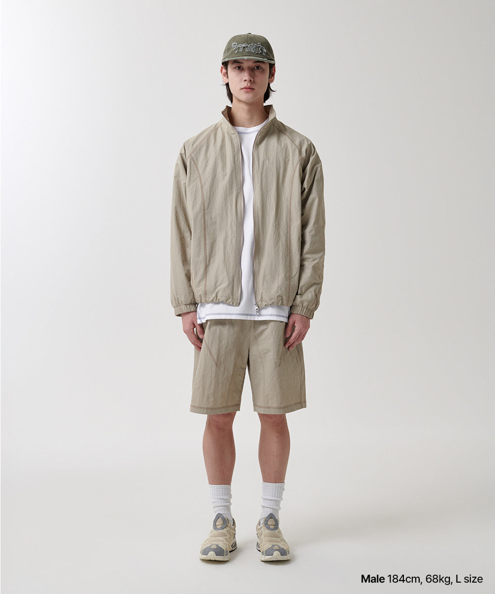Mahagrid Cover Stitch Nylon Track Jacket [Beige]