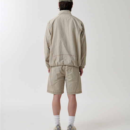 Mahagrid Cover Stitch Nylon Track Jacket [Beige]