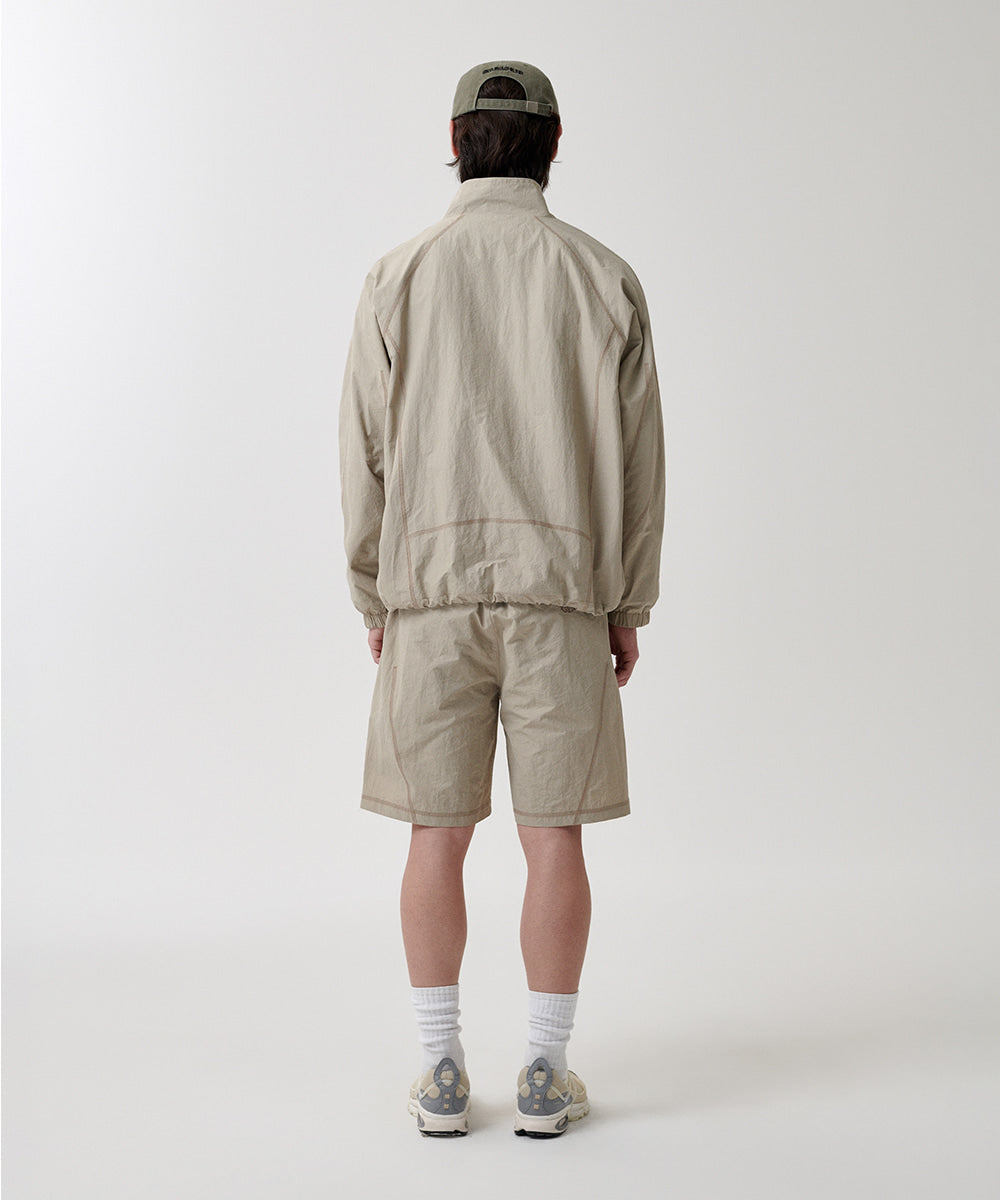 Mahagrid Cover Stitch Nylon Track Jacket [Beige]