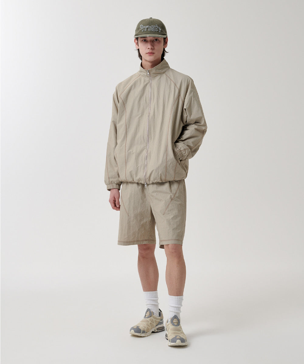 Mahagrid Cover Stitch Nylon Track Jacket [Beige]
